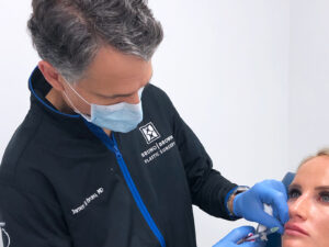 Dr. Bruno injecting lip filler