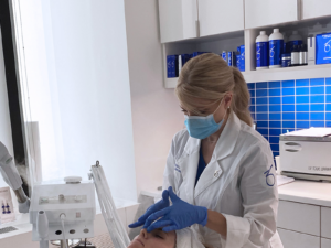 Jennifer performing skincare treatment