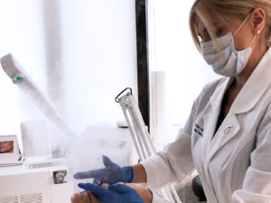 Jennifer performing skincare treatment