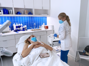 Top DC aesthetician treats a patient at the Bruno Brown skin care center