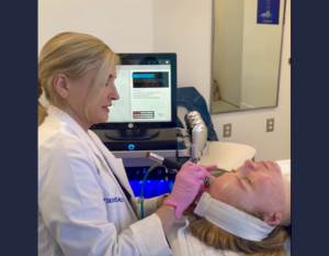 Skin care specialist preforming a HydraFacial